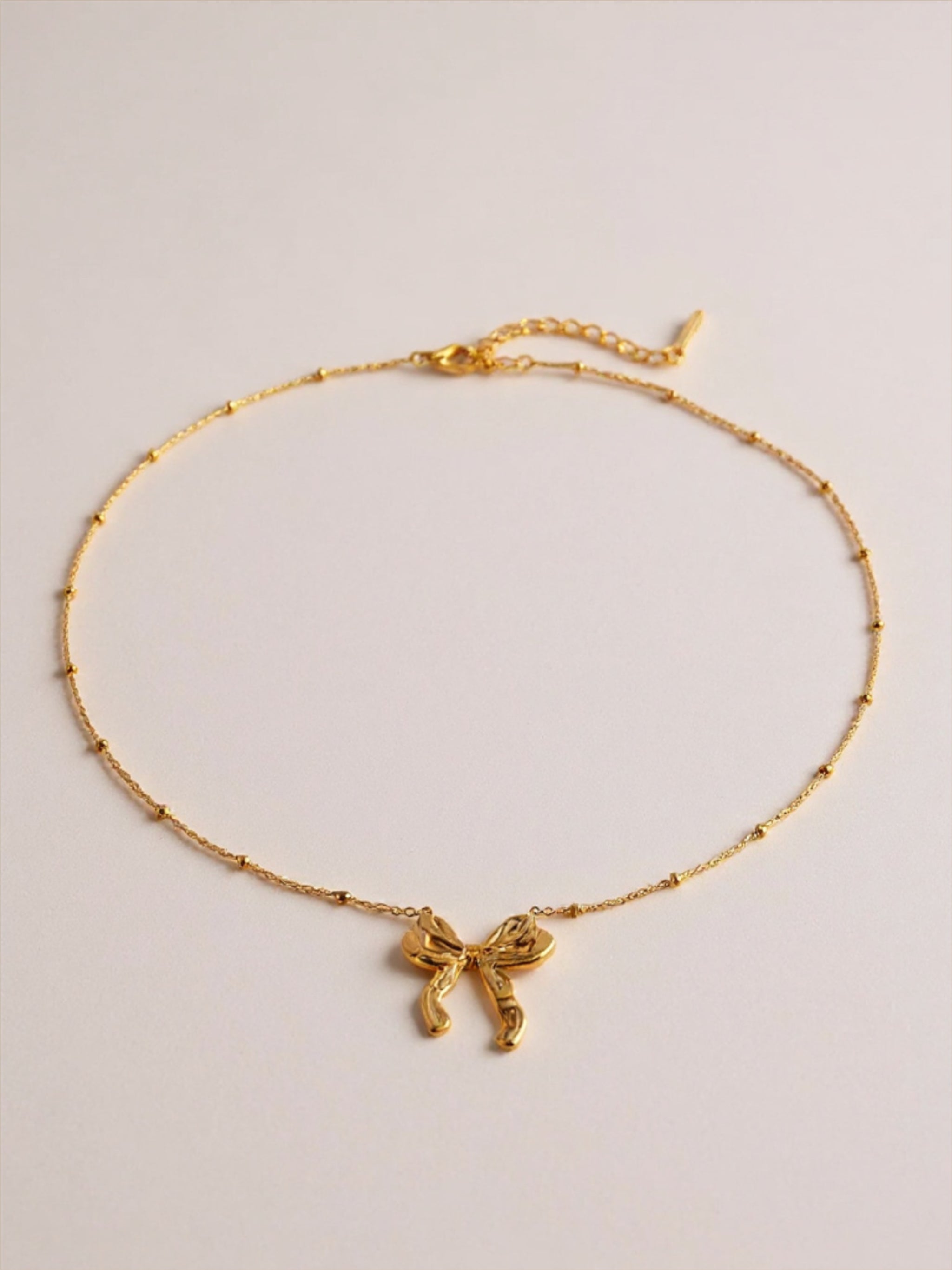 Gold Stainless Steel Bow Pendant Necklace