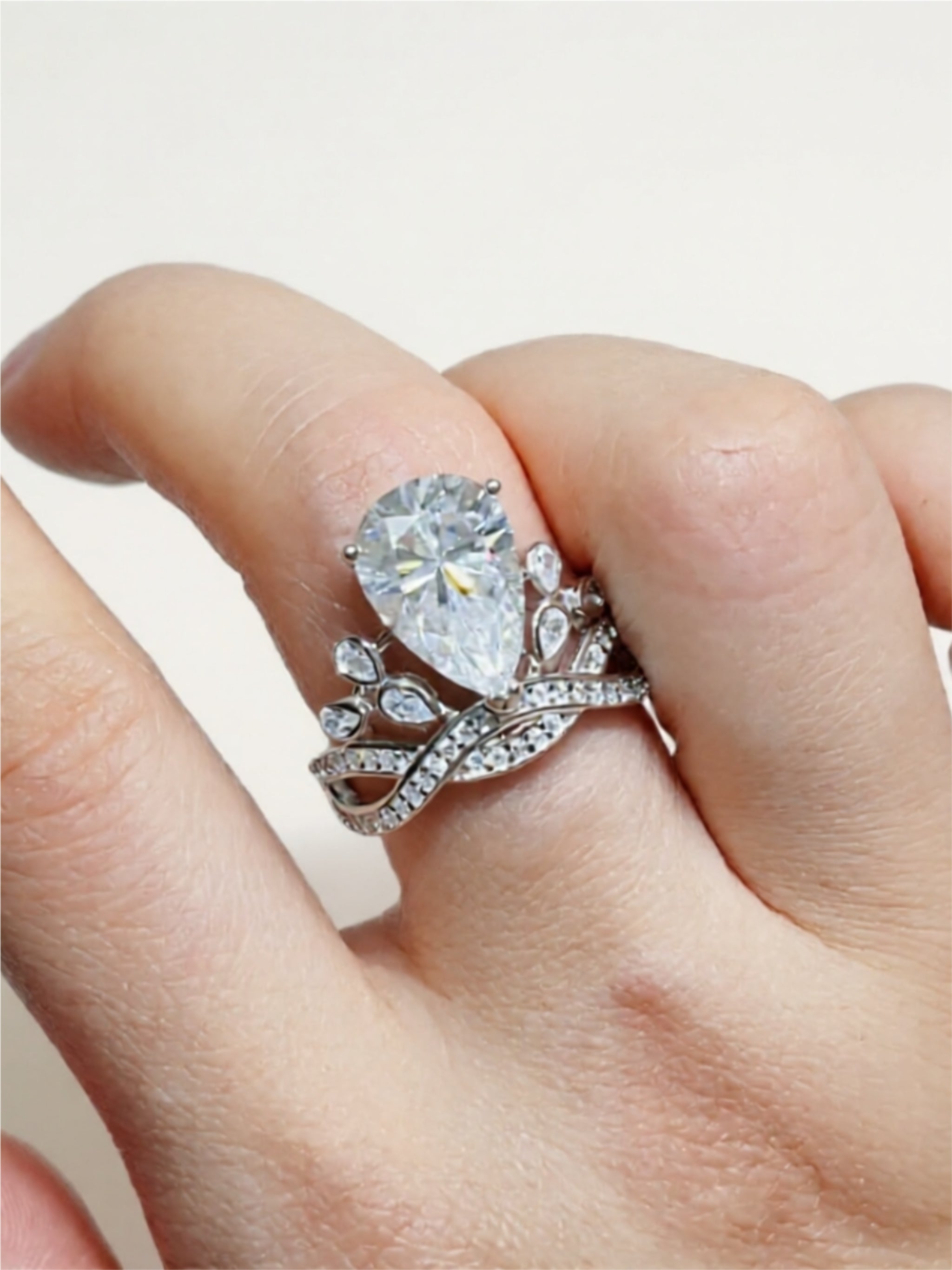Sterling Silver Ring with 5-Carat Pear-Shaped Moissanite & CZ Accents