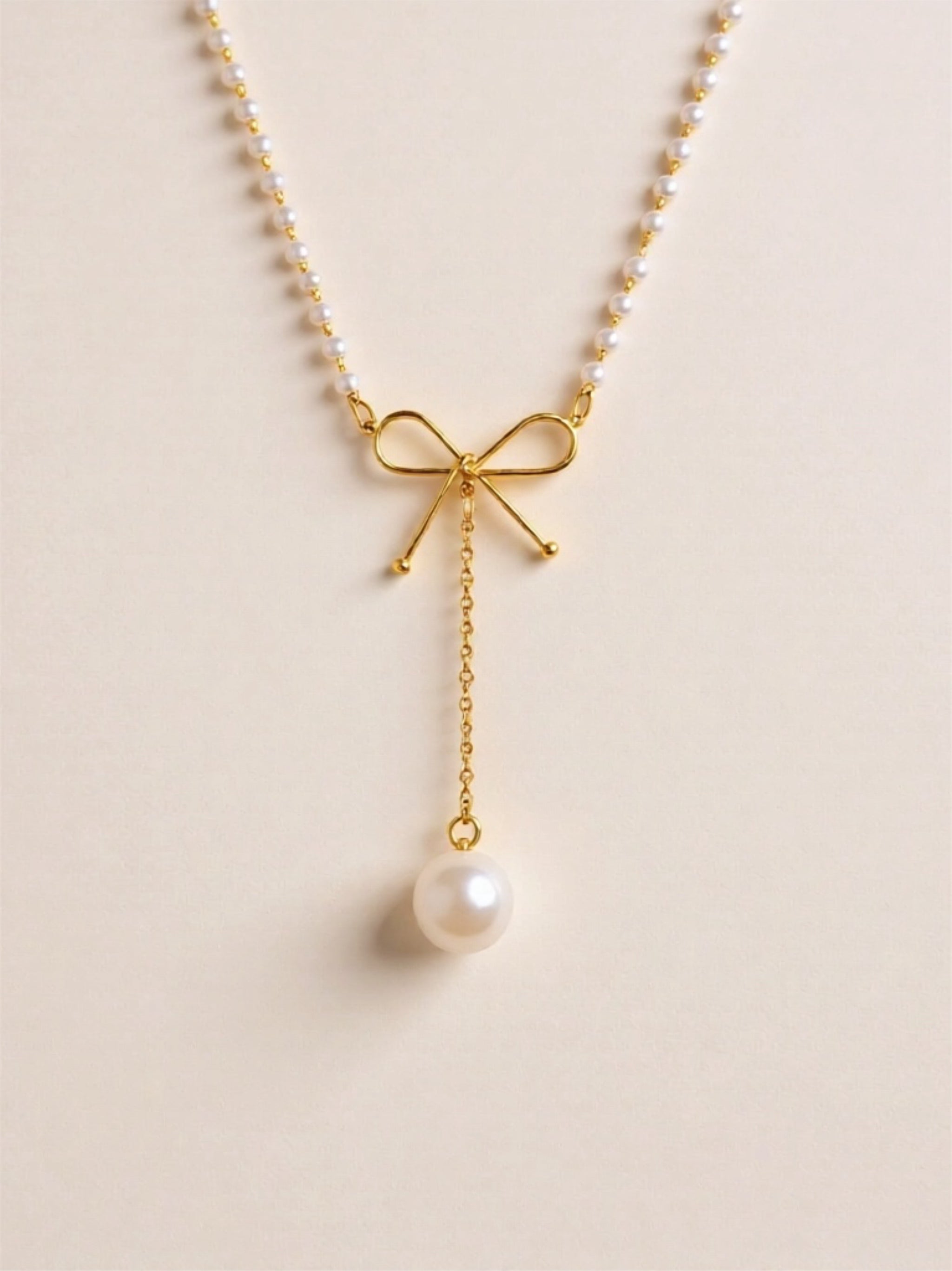 Stainless Steel Bow Pendant Necklace with Pearls