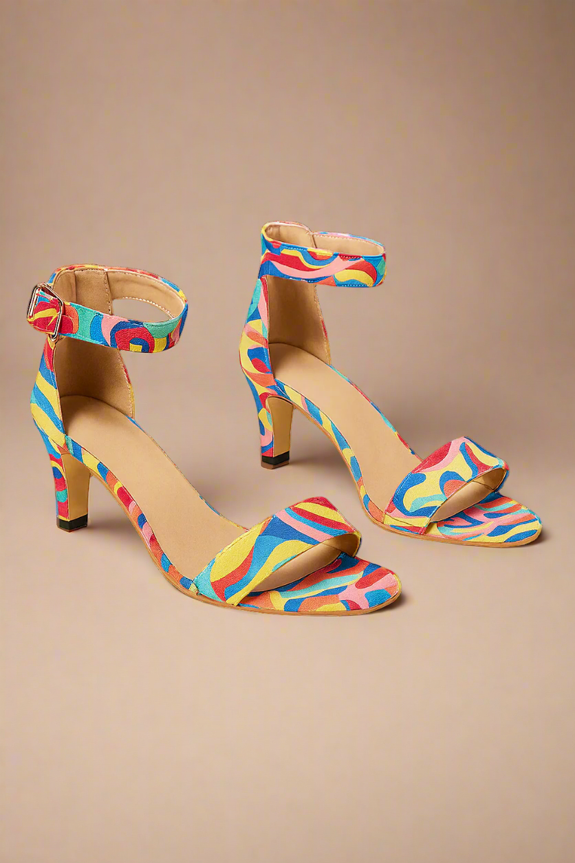 Colorful high-heeled sandals with a pattern on a white background