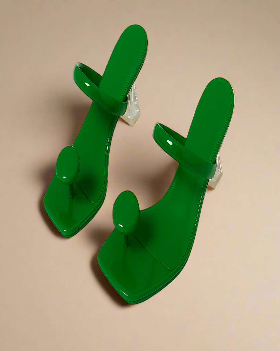 Pair of green plastic clips on a white background